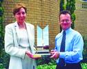 Honeywell Southern Africa's MD, Nick Buick and Quality Manager, Hettie Viljoen with the trophy for the South African Excellence Award at Honeywell's Midrand premises